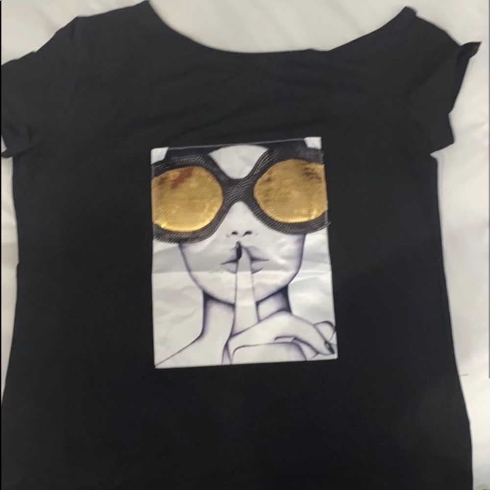 A black off the shoulder t-shirt.